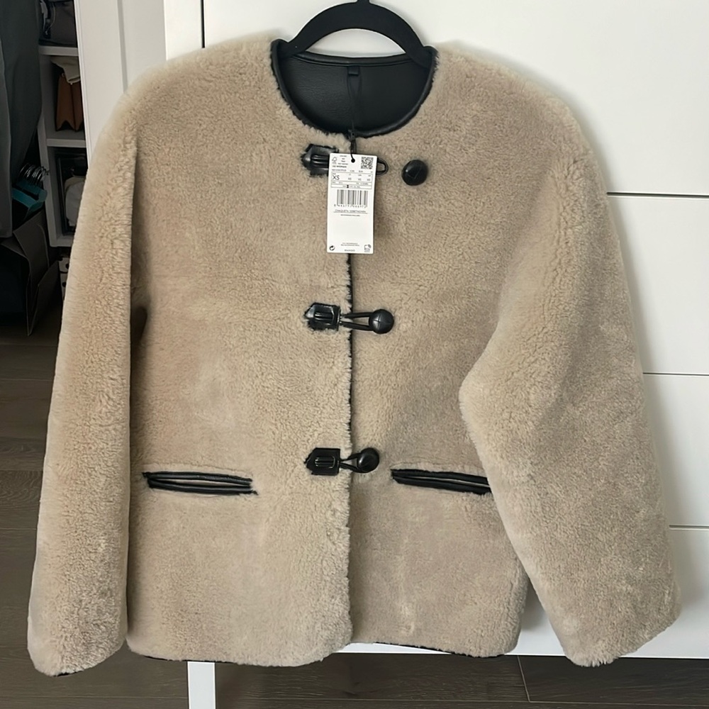 Mango Fur-effect coat with appliqués